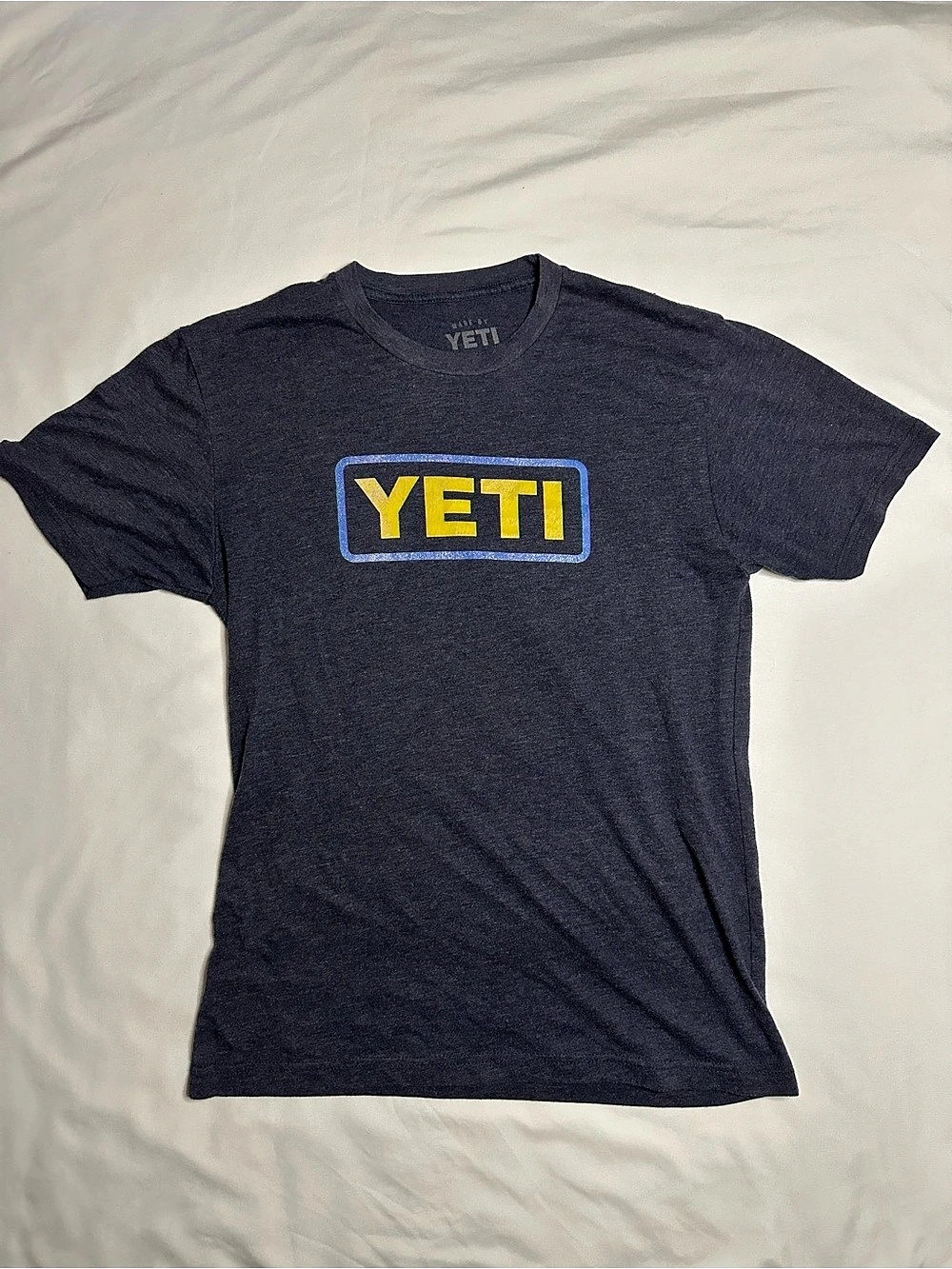 Yeti navy blue t-shirt with yellow logo
